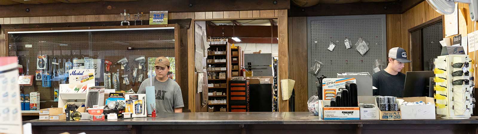 two employees at the service counter