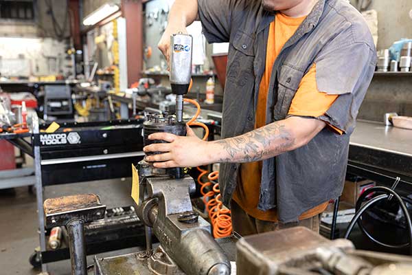 employee repairing equipment