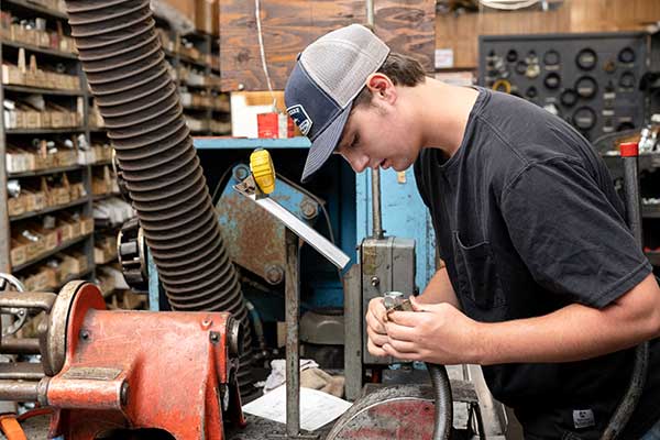 employee looking at a part